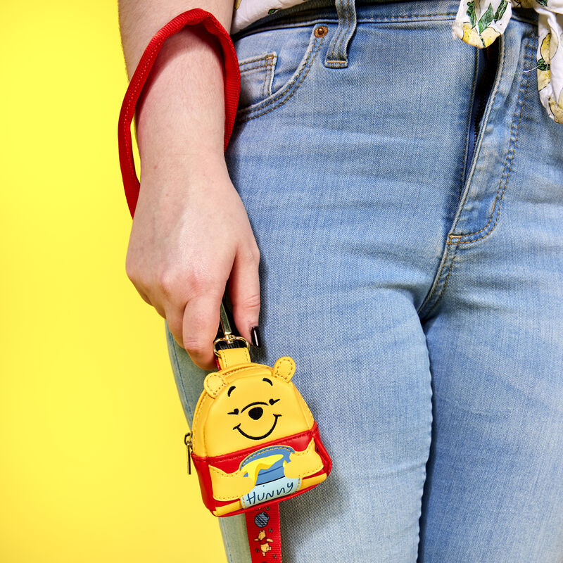 Image of someone holding the Winnie the Pooh Treat Bag and Leash